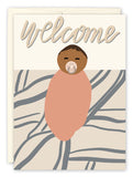 The Welcome New Baby Card by Amy Slaughter features welcome at the top and an illustrated swaddled baby with a pacifier, printed on high-quality recycled paper with a wavy gray and beige patterned background.