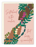 Two hands of different skin tones grasp each other amid green vines. The Sisterhood Friendship Card by Amy Slaughter reads: Sisterhood is the anchor that keeps us connected, and is thoughtfully printed on recycled paper.