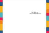 The Hey Girl Birthday Card by Andrea Williams is printed on eco-friendly recycled paper, with colorful vertical stripes on both edges and bold black text in the center-right that says: HEY GIRL HEY! ITS YOUR BIRTHDAY!.
