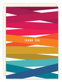 The Colorful Thank You Card by Andrea Williams features angled, vibrant stripes with “THANK YOU” in white at the center. Printed on recycled paper, it includes an off-white envelope partially visible behind the card.