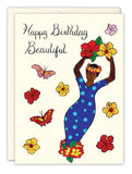 The Beautiful Queen Birthday Card by Cherrymae Golston features Happy Birthday Beautiful in cursive, a woman in a blue polka-dot dress with yellow flowers, butterflies, and vibrant details—perfect for celebrating the queen in your life.