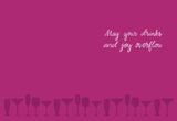 A magenta background with drink glass silhouettes lines the bottom. May your drinks and joy overflow is written in white script at the top right. Cheers Birthday Girl Card, illustrated by Lauren-Ashley Barnes on recycled paper.