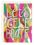 The Let’s Celebrate Birthday Card by Lauren-Ashley Barnes features colorful brushstrokes and bold silver “LETS CELEBRATE” text. Printed on recycled paper, it comes with an envelope.