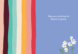 The Happy B-Day Black Queen Birthday Card by Lauren-Ashley Barnes features vertical wavy stripes, a purple background, white daisies, and “May you continue to bloom in grace.” Printed on premium recycled paper.