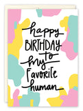 The Favorite Human Birthday Card by Natalie Henry Charles features pastel pink, yellow, and teal blobs on white with happy BIRTHDAY to my favorite human in playful black text. High-quality printing brings this illustrated card to life.