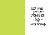 The Like Guac Birthday Card by Natalie Henry Charles is made from recycled paper with a green left half and a white right half, featuring handwritten text: Keep living your over-the-top life. Happy birthday.