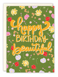 The Floral Beautiful Birthday Card by Natalie Henry Charles features happy BIRTHDAY beautiful in bold yellow script on a green, floral background and is printed on recycled paper—perfect for an eco-friendly celebration.