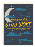 The Stay Woke New Baby Card by Tiffany Grimes features a dark blue sky with clouds, stars, a crescent moon, colorful accents, and the message: may your baby STAY WOKE except when you’re trying to sleep. Congratulations!.