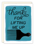 The Lifting Me Up Thank You Card by Tiffany Grimes features a blue background, “thanks FOR LIFTING ME UP” text, and an Afro pick comb with a raised fist. Printed on recycled paper.