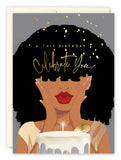 The Celebrate You Birthday Card by Tiffany McGraw features an illustrated woman with curly hair and red lips, hands on her face, with gold confetti and a lit cake. Gold script reads This Birthday Celebrate You. Printed on recycled paper.