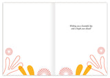 The Happy Birthday Sunshine Card by Andrea Williams is made from recycled paper, features abstract orange and yellow shapes with red sunburst patterns, and has the message: Wishing you a beautiful day and a bright year ahead! inside.