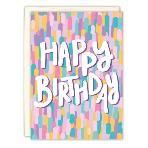 The Colorful Confetti Birthday Card by Natalie Henry Charles features HAPPY BIRTHDAY in bold white letters surrounded by vibrant pastel brush strokes, and is crafted from recycled paper to spread extra love and joy.